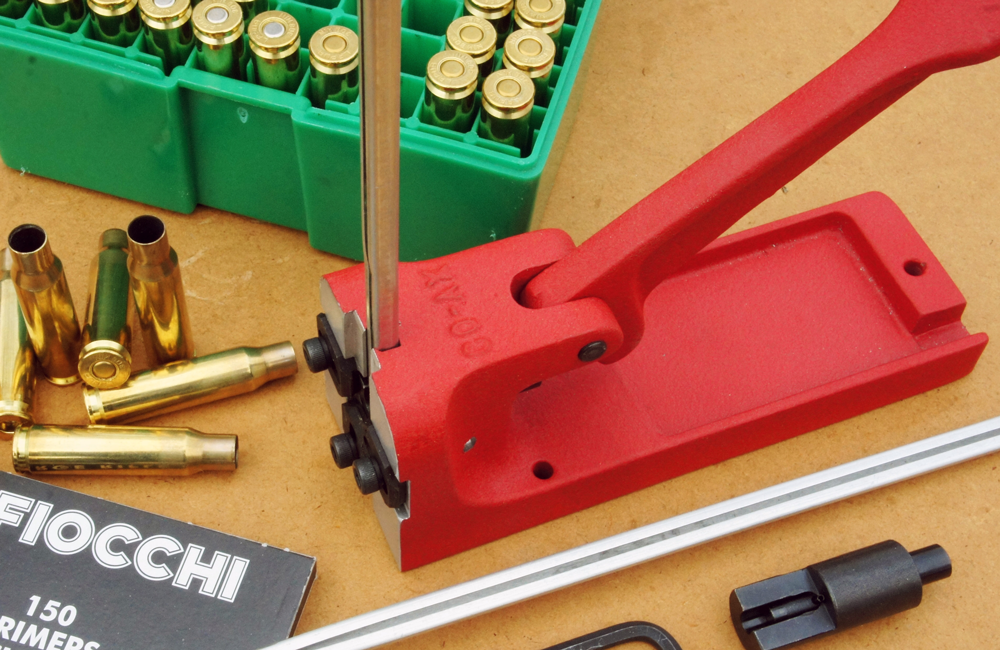Primer seating explosions pose a major risk especially in magazine fed tools or progressive reloading. Note the folded light metal magazine and gap on its front in this Forster bench priming tool to allow the tube to fail easily and avoid a major chain explosion in a sealed tube should the primer being seated detonate.