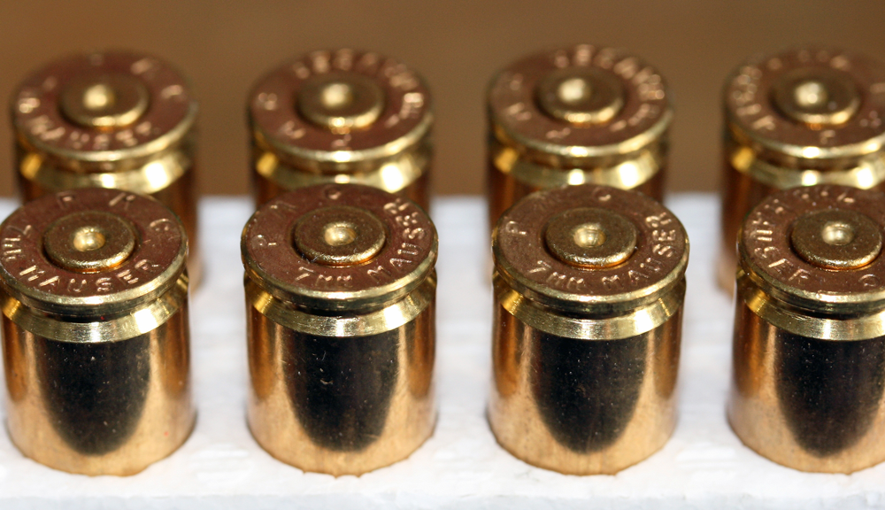 PMC brass with backed-out primers – light load + excessive headspace.