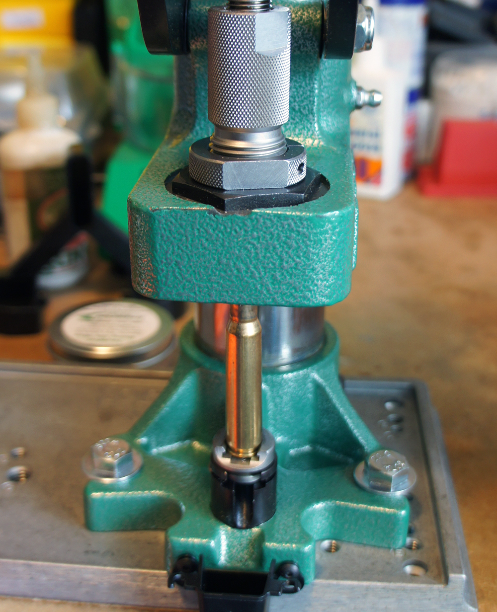 The press handle is now half-way between the beyond the vertical at-rest and horizontal positions.