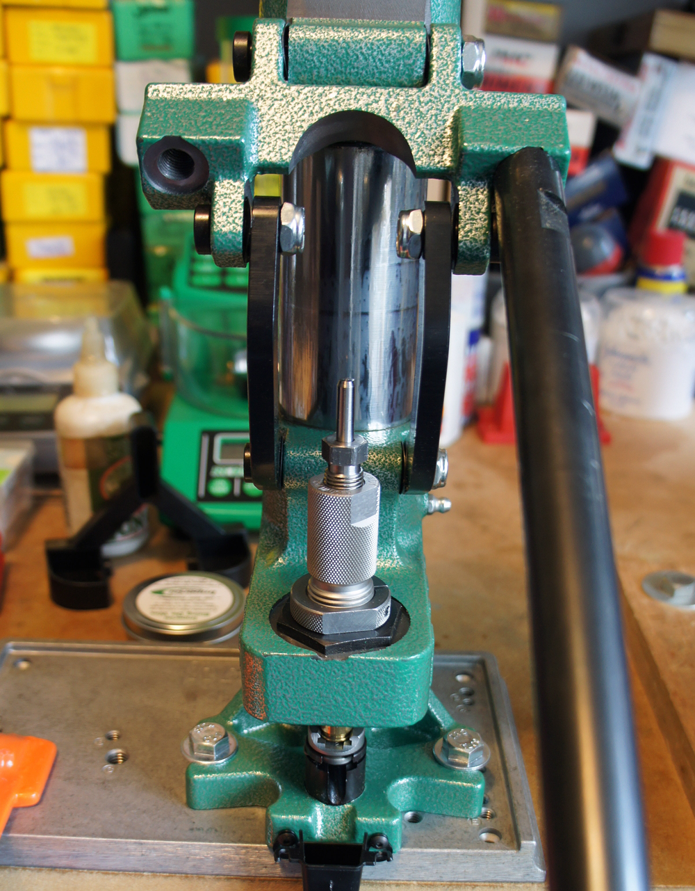 The handle is now horizontal but the die has another half to three-quarters inch movement before sizing is complete.