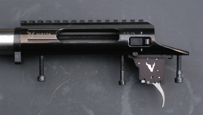 The Pic-rail is pinned and held by six screws. Note the three action screws and the impressive Flavio Fare designed trigger. Substantial recoil-lug is also pinned